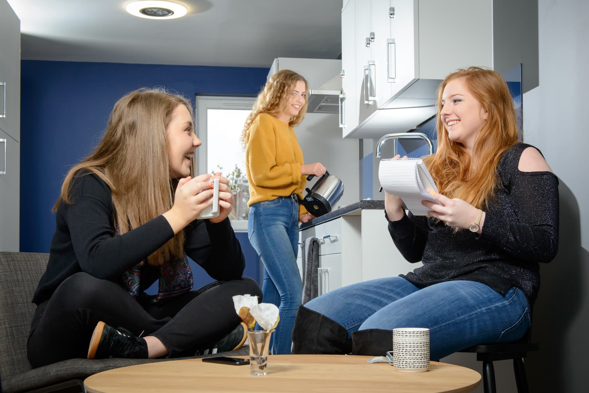 Students in a shared kitchen